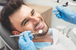 Man having teeth examined at dentists