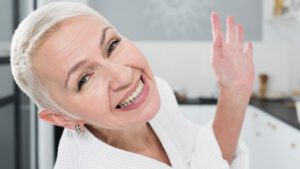 Senior woman smiling after following oral care tips